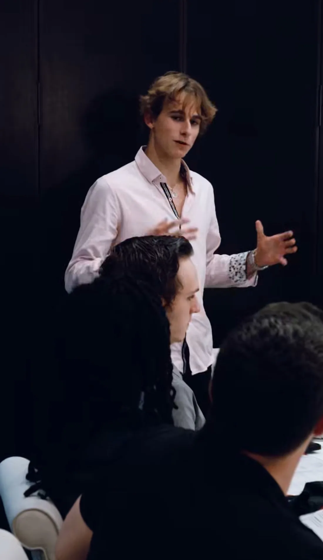Jayden Clark of The New World Agency walking a room of business owners through where AI fits in their operations